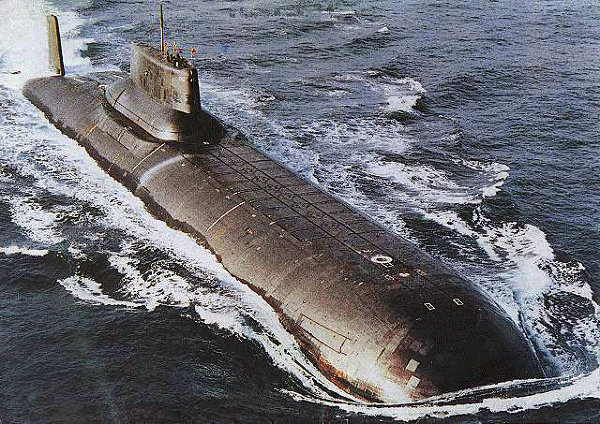 Soviet Akula-class nuclear-powered ballistic missile submarines were first deployed in 1980. Akula-class subs are the largest submarines ever built; they are up to 175 meters in length and 23 meters wide, and are capable of accommodating a crew for many months once submerged.  Armed with a formidable nuclear missile armament and capable of hitting targets as far as 8,300 km, “Sharks” can launch their long-range nuclear missiles while submerged or moored at the docks. Their ultra-quiet engines allowed them to move through NATO waters undetected.<br /><br />Above: Akula-class submarine is ready to submerge underwater.